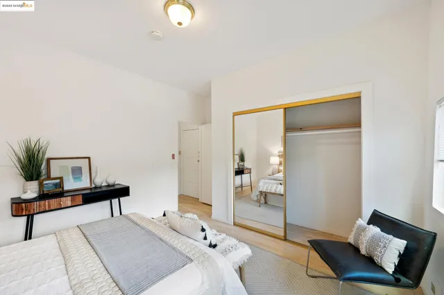 a bedroom with a bed and lamp