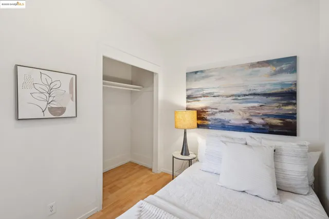 a view of a hallway with paintings on the wall