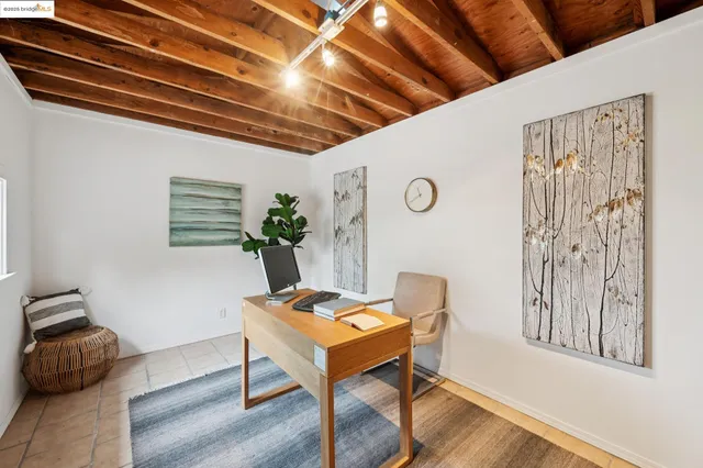 a workspace with furniture and wooden floor