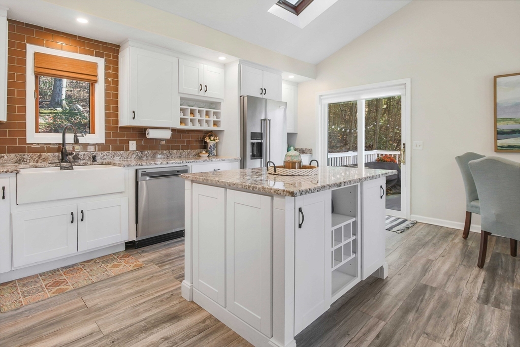 96 Indian Hill Road Worcester, MA 01606 - Photo 13 of 42 a kitchen with a sink stove and cabinets