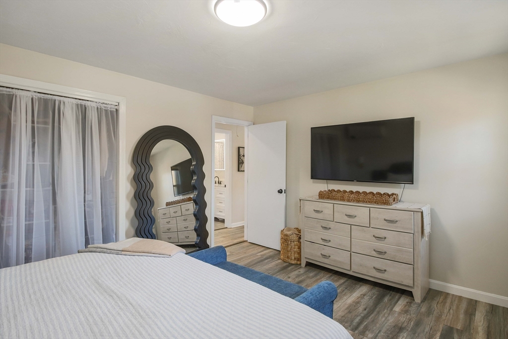 96 Indian Hill Road Worcester, MA 01606 - Photo 16 of 42 a bedroom with furniture and flat screen tv