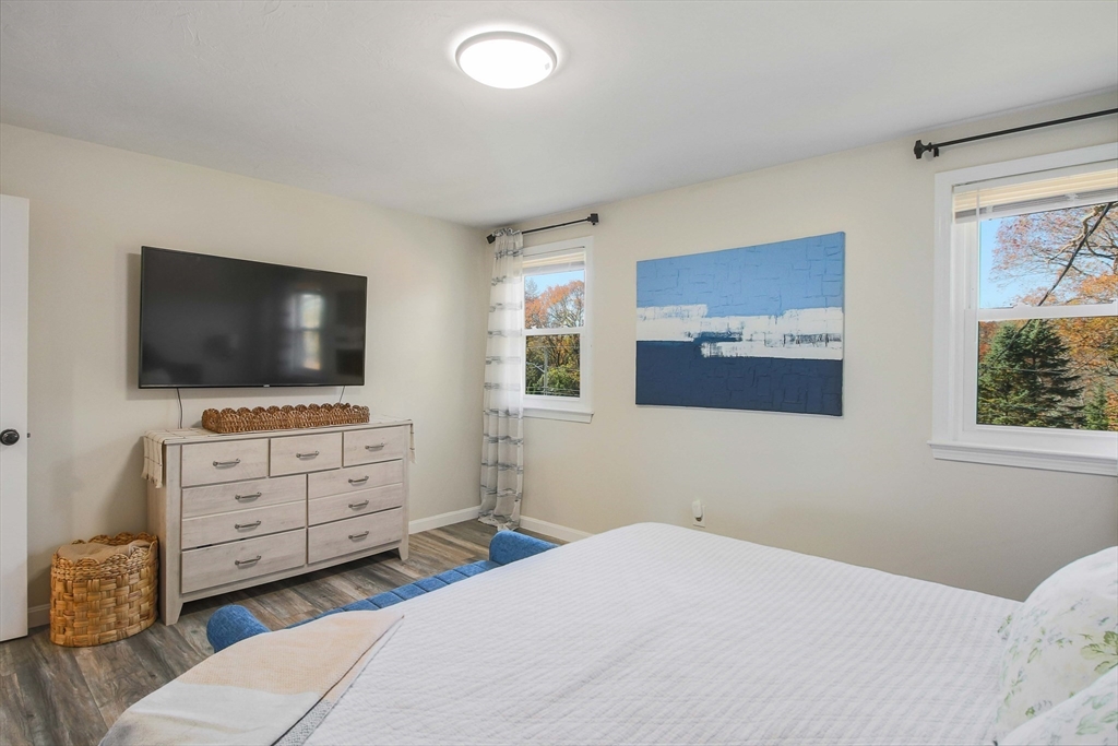 96 Indian Hill Road Worcester, MA 01606 - Photo 17 of 42 a bedroom with furniture and a flat screen tv