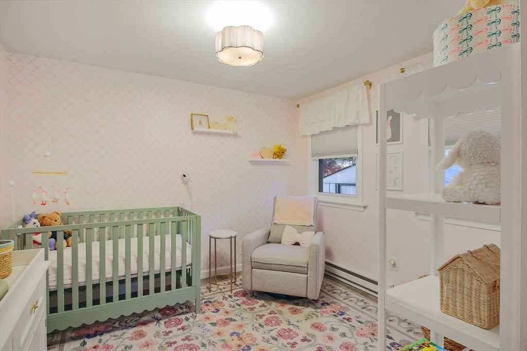 96 Indian Hill Road Worcester, MA 01606 - Photo 18 of 42 a bedroom with a bed and wooden floor