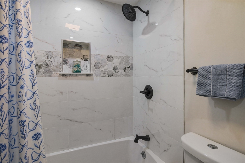 96 Indian Hill Road Worcester, MA 01606 - Photo 23 of 42 a bathroom with a bathtub and shower