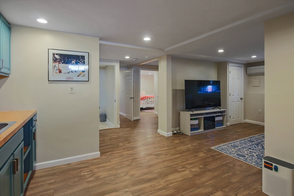 96 Indian Hill Road Worcester, MA 01606 - Photo 27 of 42 a living room with furniture and a flat screen tv