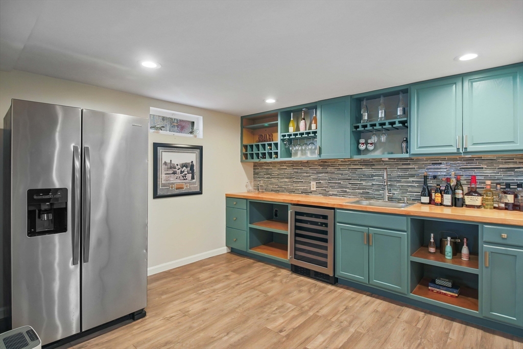 96 Indian Hill Road Worcester, MA 01606 - Photo 28 of 42 a kitchen with stainless steel appliances granite countertop a refrigerator and a sink