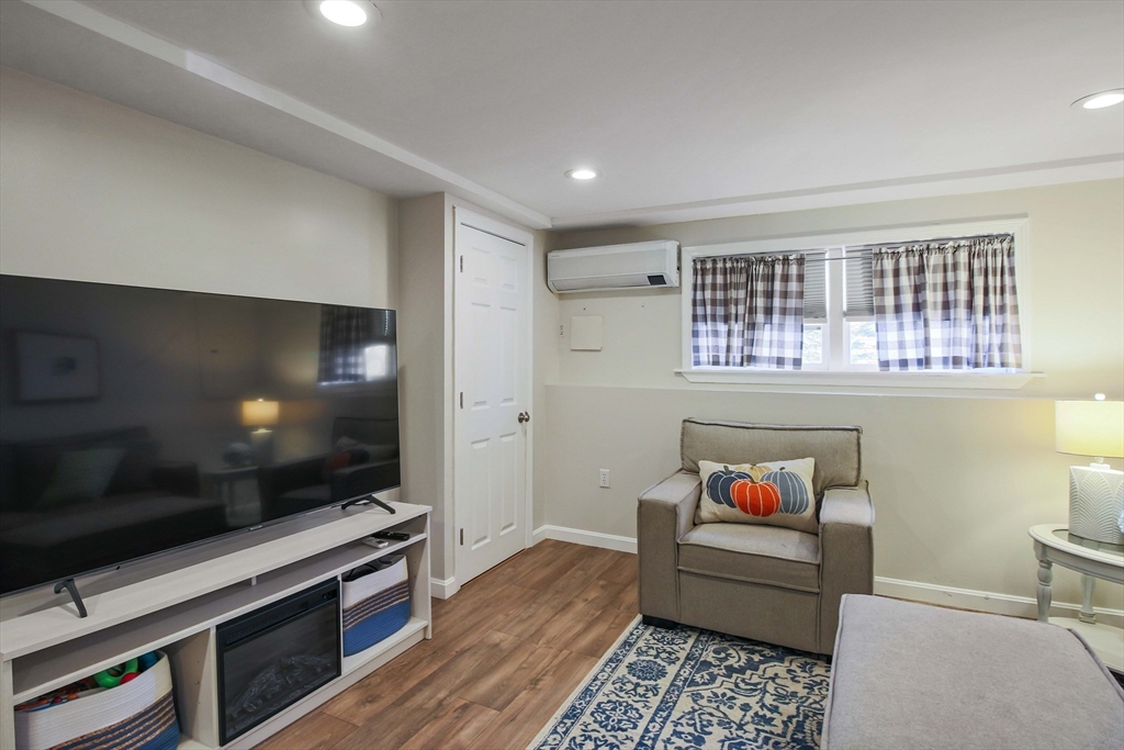 96 Indian Hill Road Worcester, MA 01606 - Photo 29 of 42 a living room with furniture and a flat screen tv