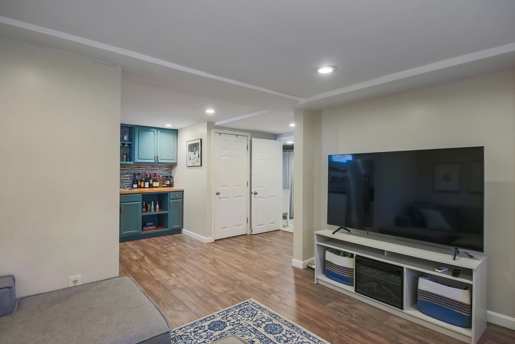 96 Indian Hill Road Worcester, MA 01606 - Photo 30 of 42 a living room with furniture and a flat screen tv
