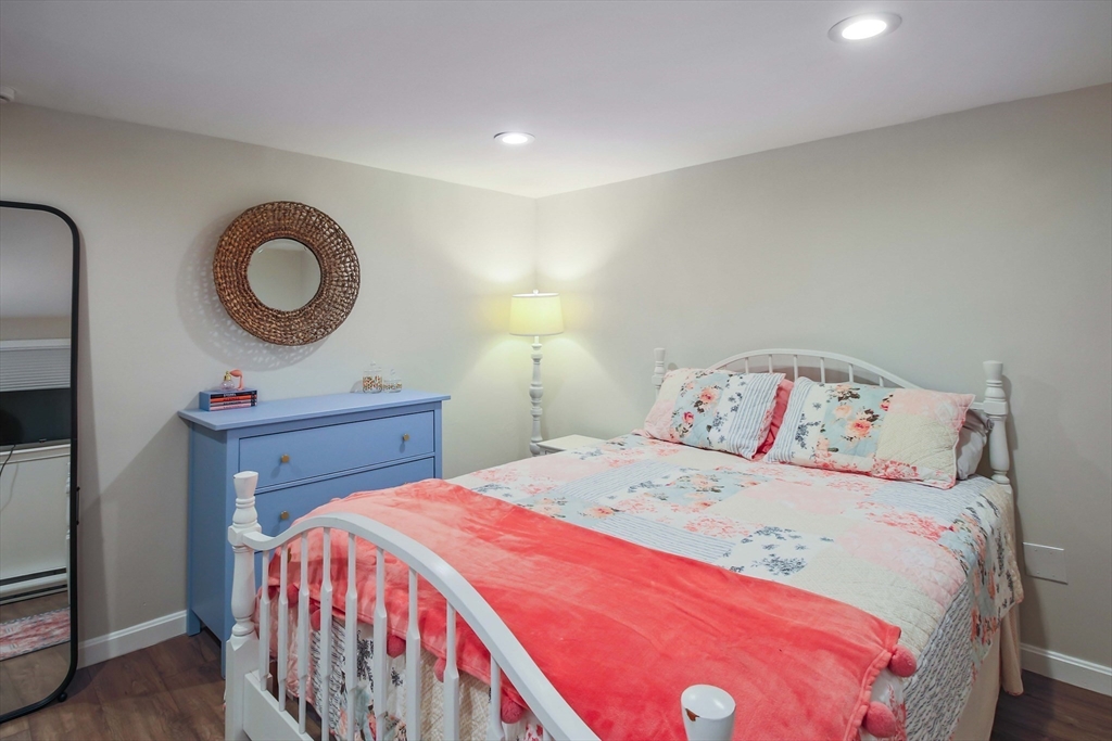 96 Indian Hill Road Worcester, MA 01606 - Photo 32 of 42 a bedroom with a bed and a mirror