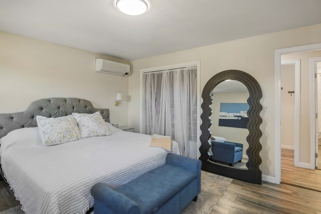 96 Indian Hill Road Worcester, MA 01606 - Photo 5 of 42 a bedroom with a bed and a potted plant on dresser