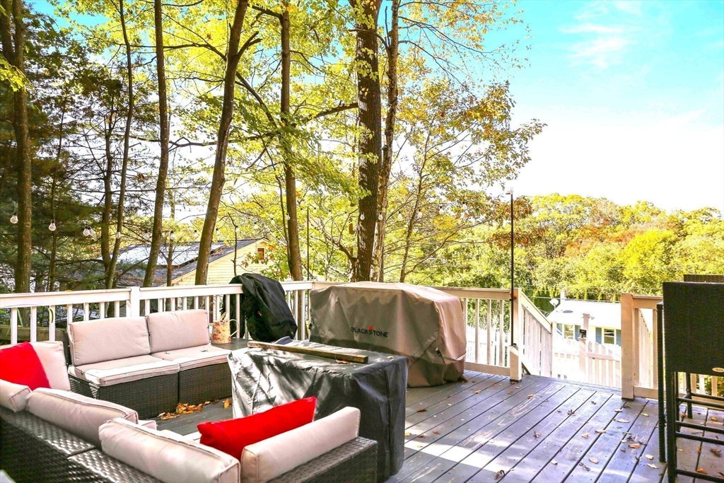 96 Indian Hill Road Worcester, MA 01606 - Photo 7 of 42 a roof deck with couches and wooden floor
