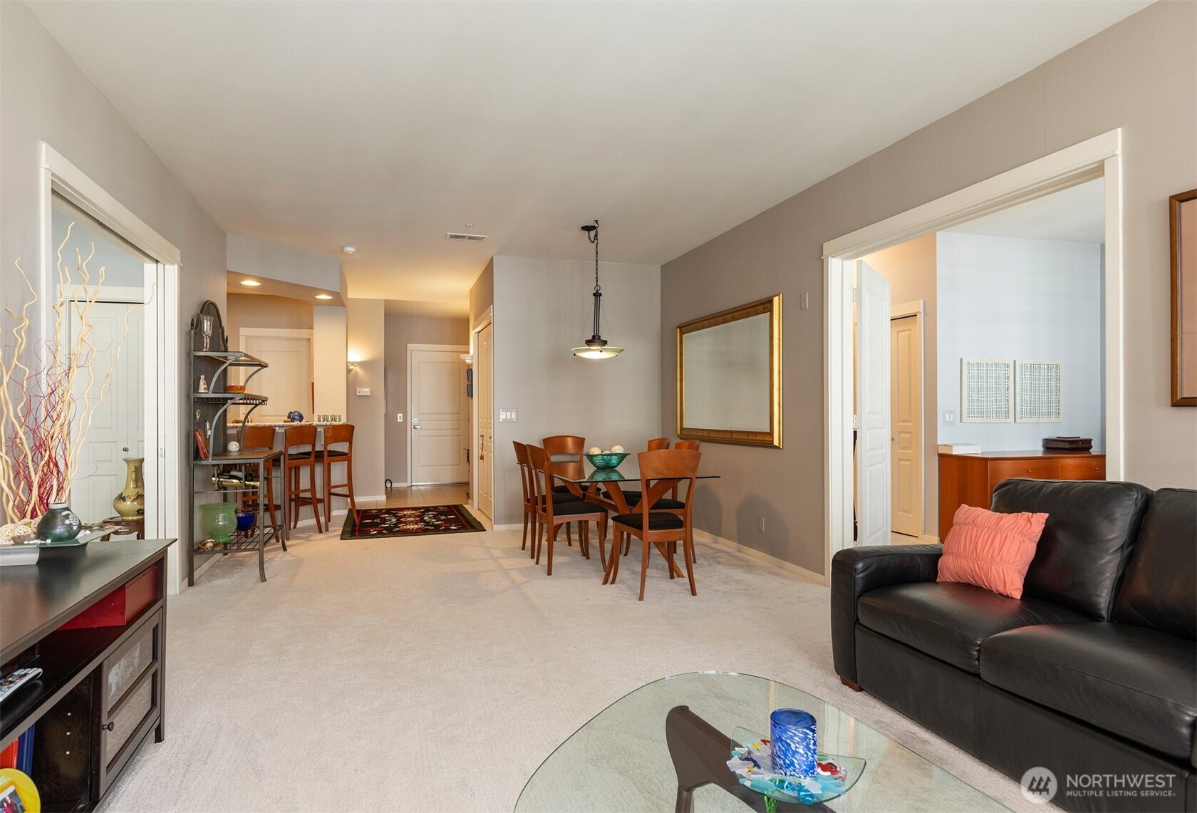2000 Alaskan Way, Unit 255 Seattle, WA 98121 - Photo 12 of 31 a living room with furniture kitchen view and a large window