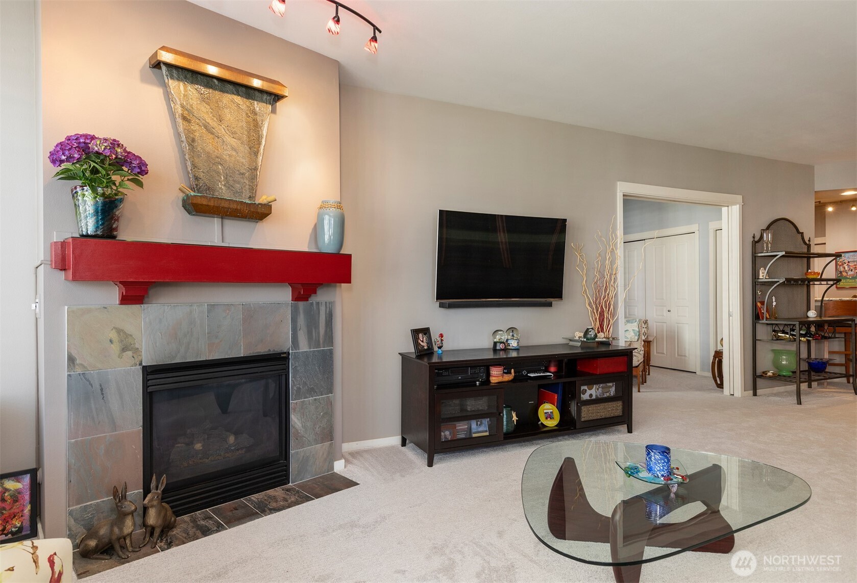 2000 Alaskan Way, Unit 255 Seattle, WA 98121 - Photo 13 of 31 a living room with furniture and a fireplace