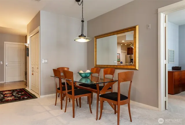 a bedroom with a bed and a window with chair