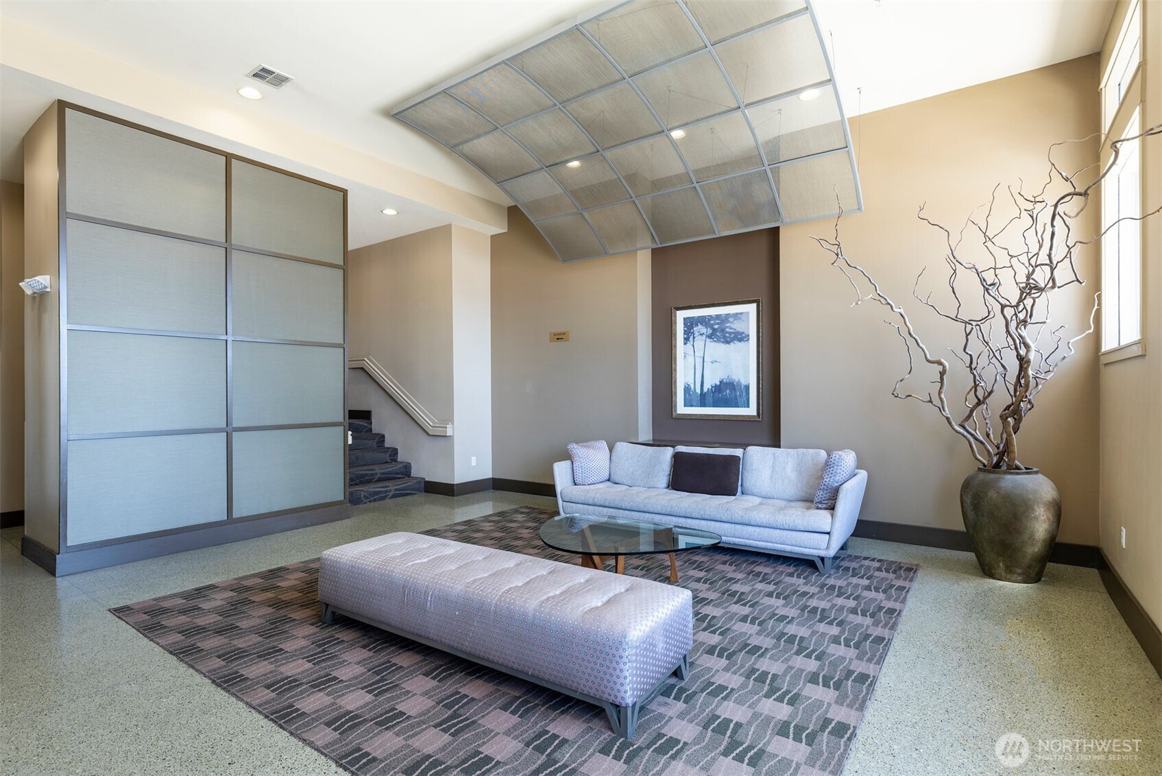 2000 Alaskan Way, Unit 255 Seattle, WA 98121 - Photo 26 of 31 a living room with furniture and a rug