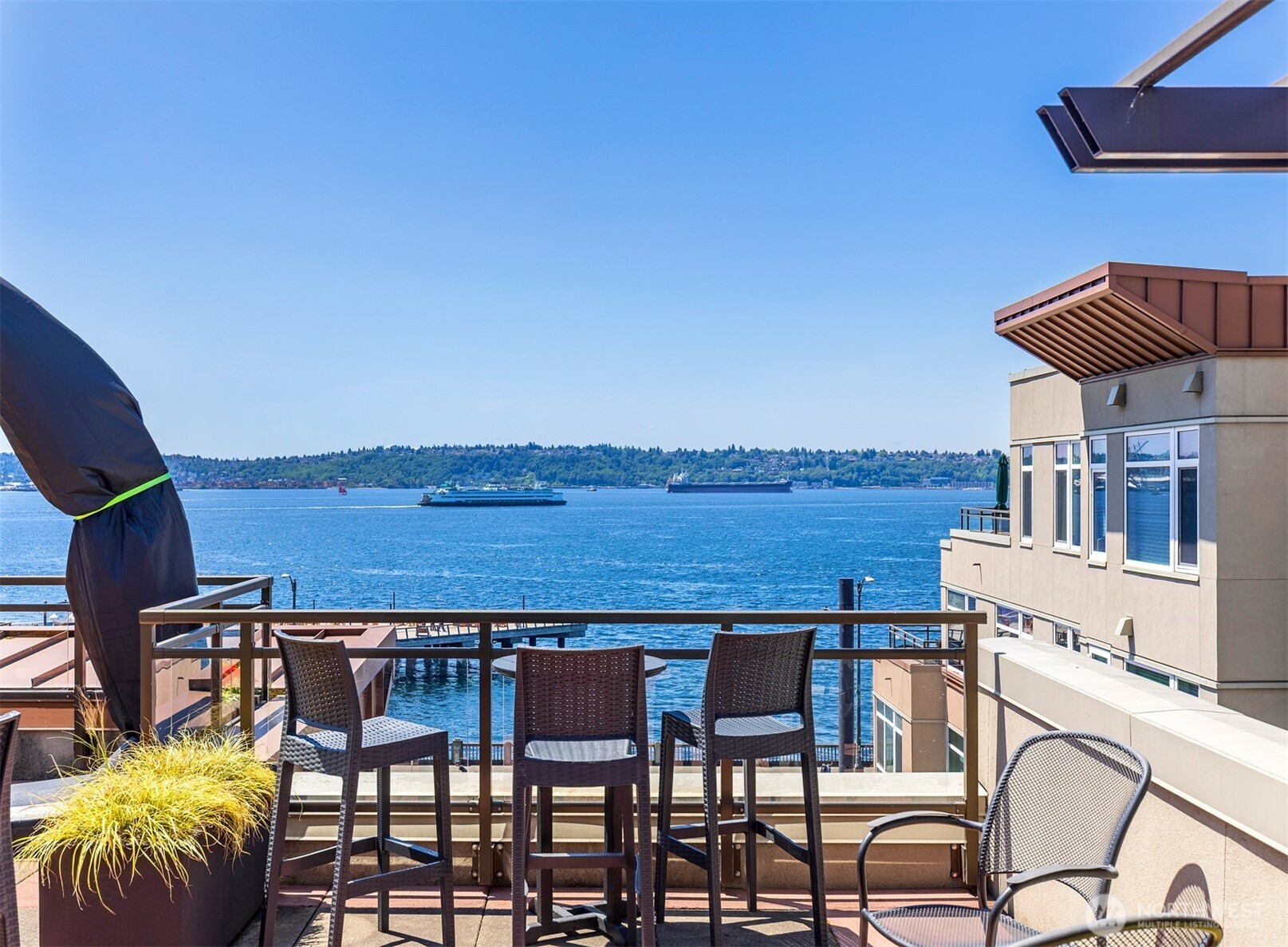 2000 Alaskan Way, Unit 255 Seattle, WA 98121 - Photo 28 of 31 a view of a chairs and table in patio