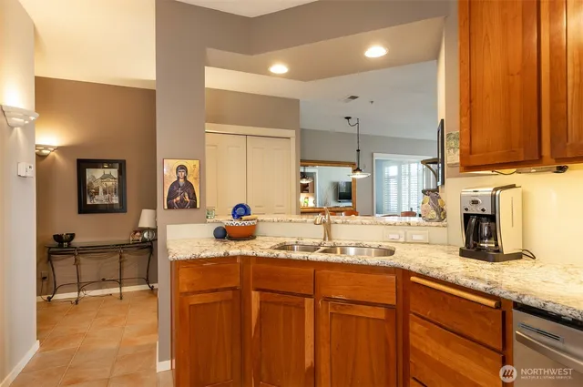 a kitchen with stainless steel appliances a refrigerator stove and microwave
