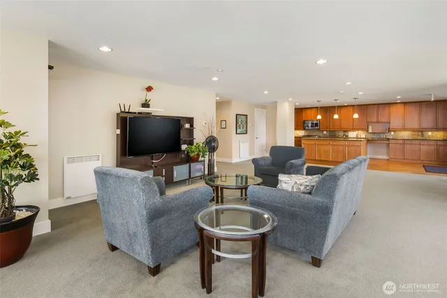 a living room with furniture and a flat screen tv