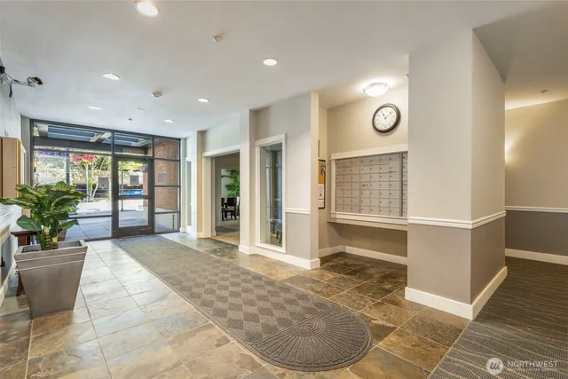a view of a livingroom with wooden floor and furniture