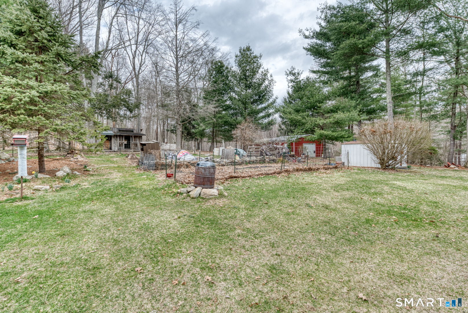 454 Providence Turnpike Hampton, CT 06247 - Photo 11 of 40 a backyard of a house with table and chairs