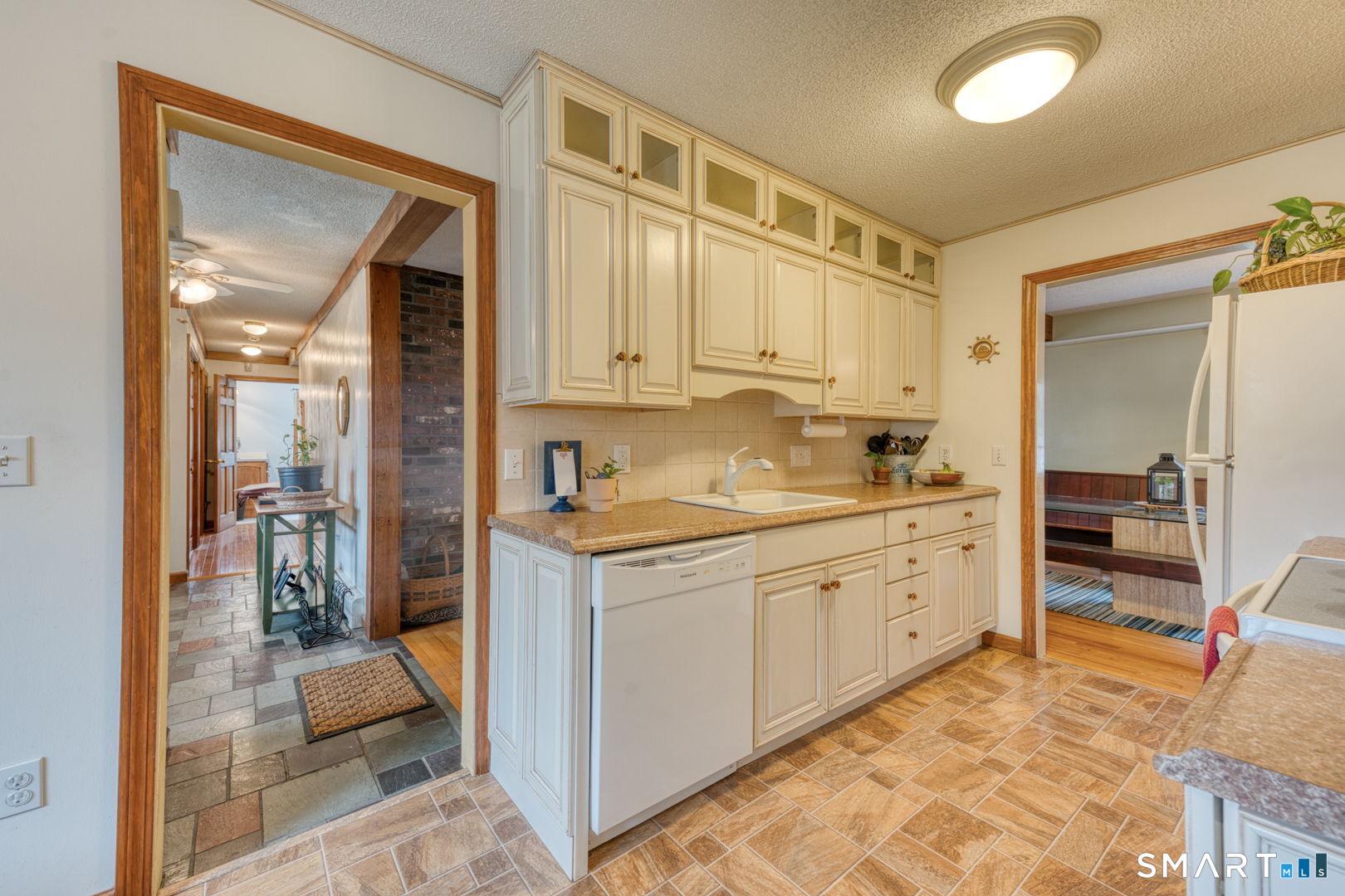 454 Providence Turnpike Hampton, CT 06247 - Photo 19 of 40 a kitchen with granite countertop a sink and cabinets