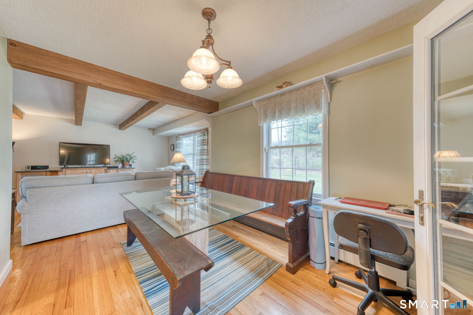 454 Providence Turnpike Hampton, CT 06247 - Photo 25 of 40 a view of a dining room with furniture and wooden floor