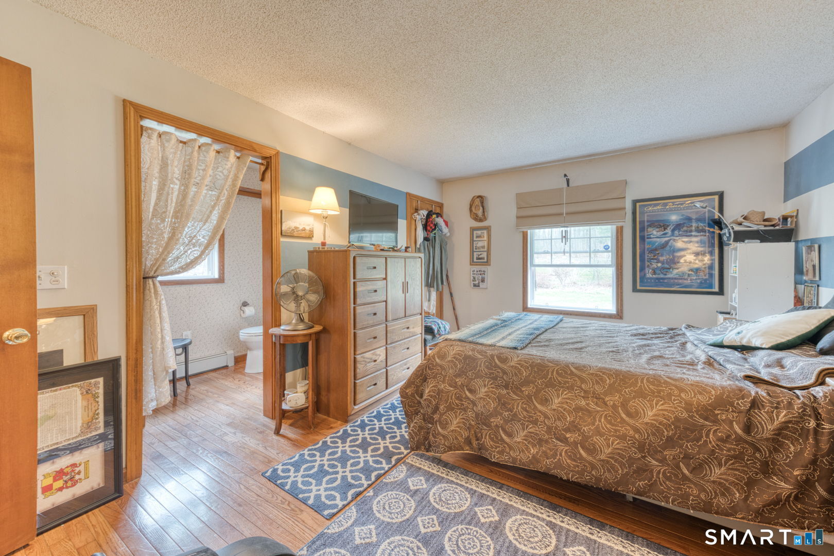 454 Providence Turnpike Hampton, CT 06247 - Photo 30 of 40 a bedroom with a bed and wooden floor