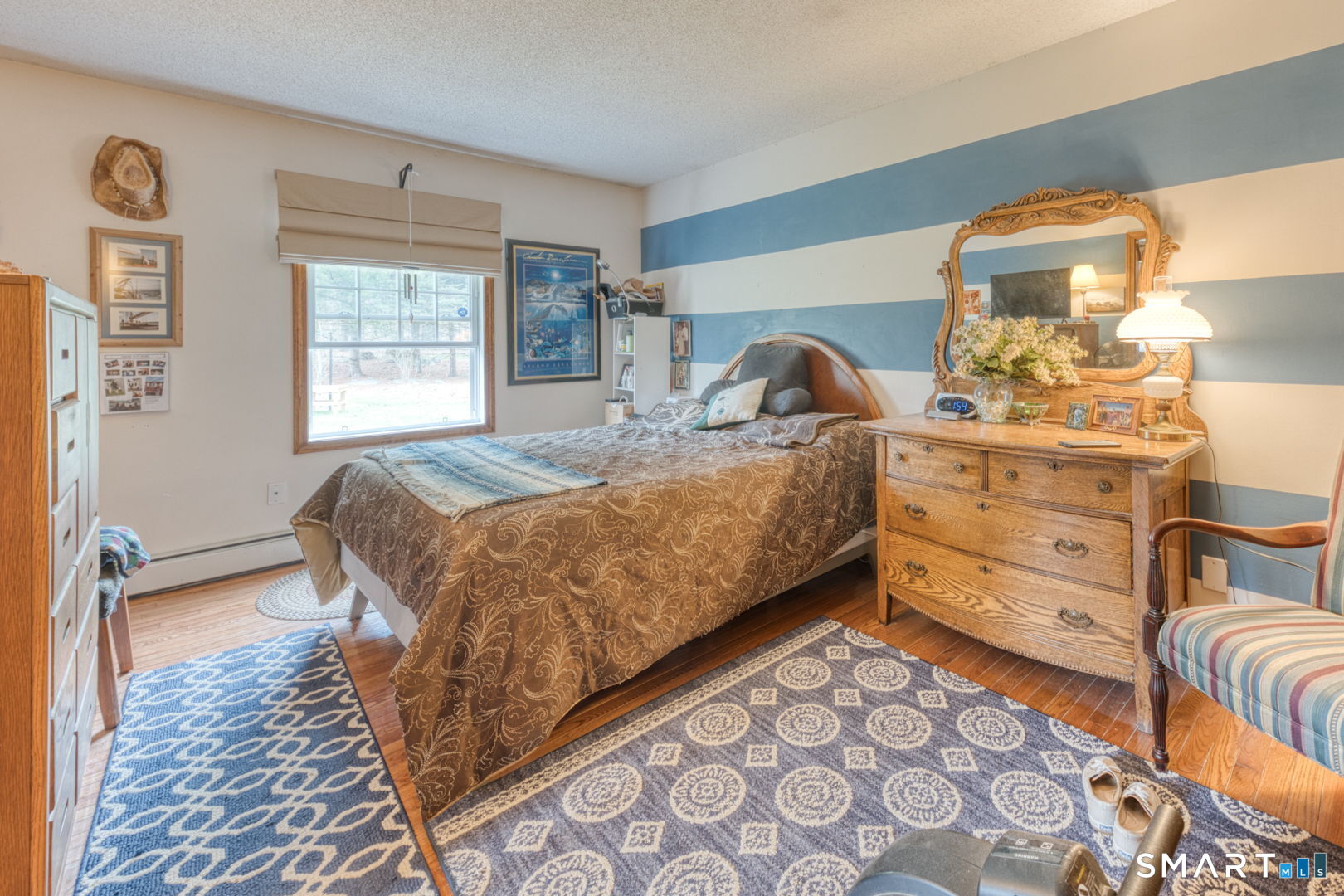 454 Providence Turnpike Hampton, CT 06247 - Photo 33 of 40 a bed sitting in a bedroom next to a window