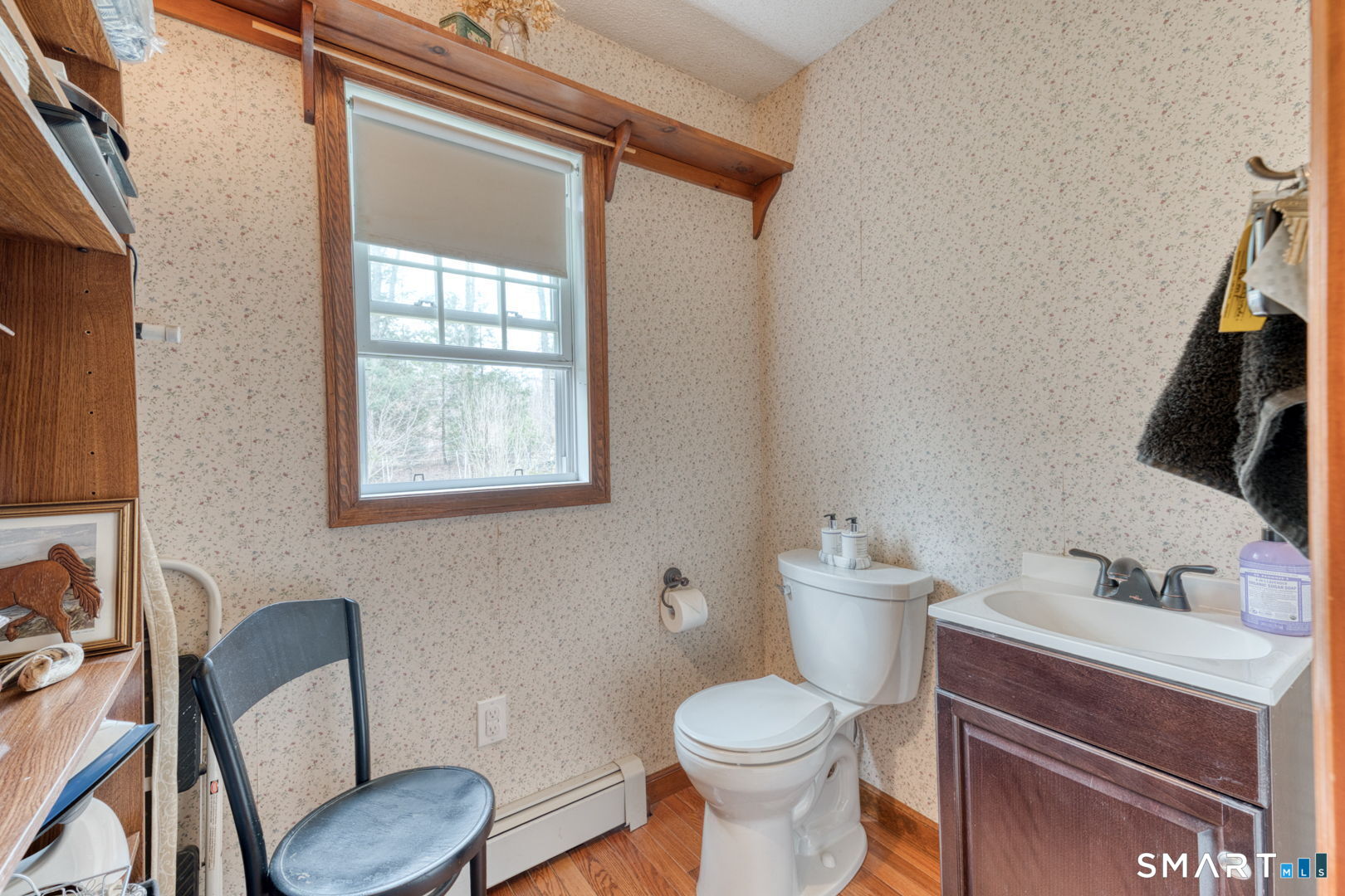 454 Providence Turnpike Hampton, CT 06247 - Photo 35 of 40 a bathroom with a toilet a sink and a mirror