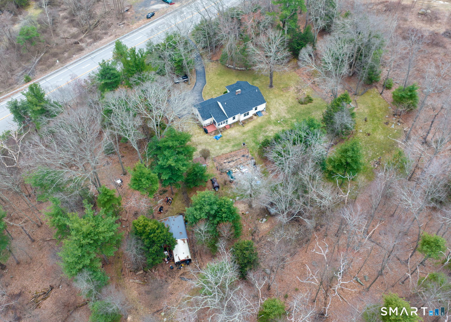 454 Providence Turnpike Hampton, CT 06247 - Photo 4 of 40 an aerial view of a house with a yard and trees all around