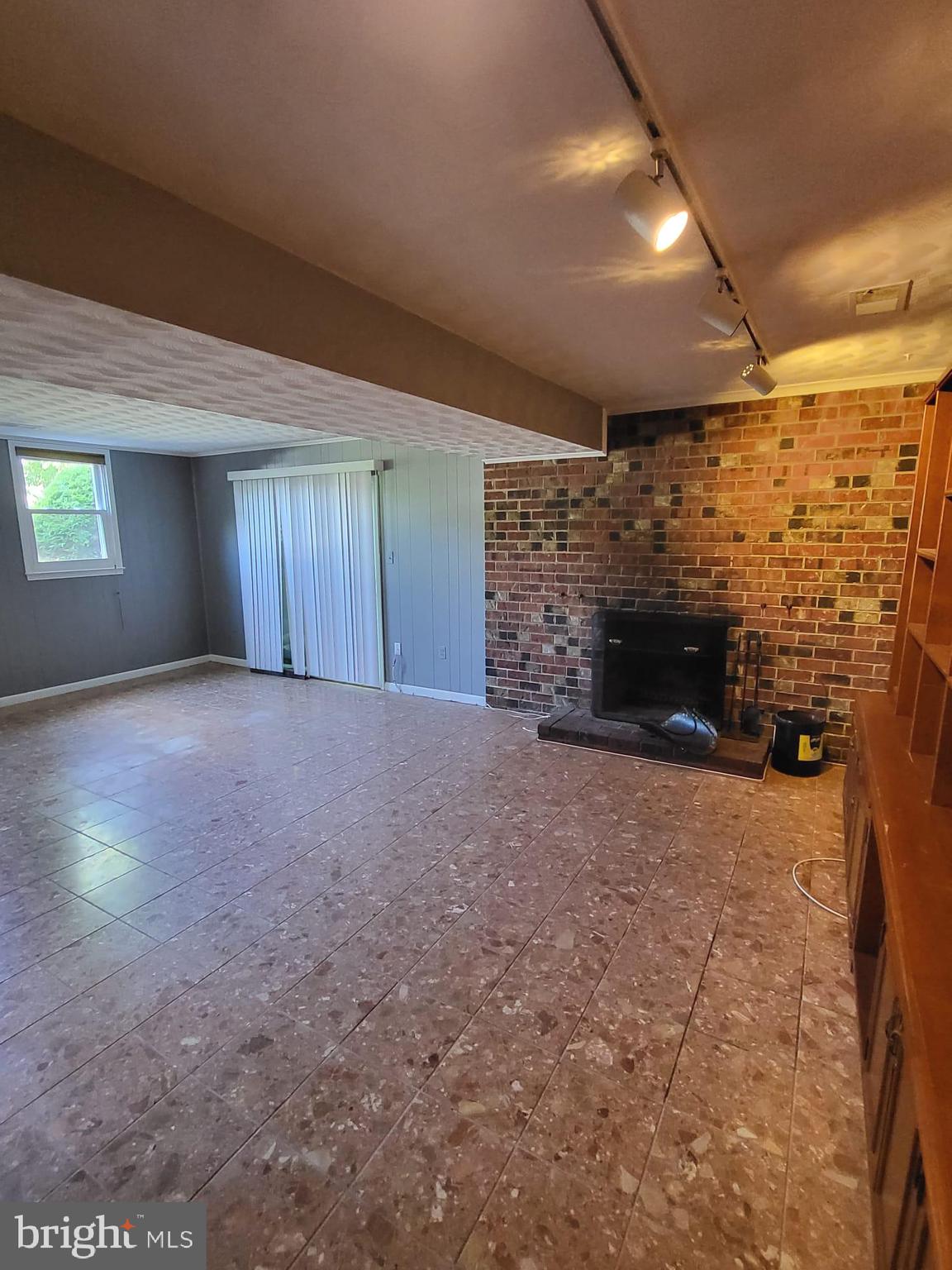 12217 Harbor Drive Woodbridge, VA 22192 - Photo 33 of 53 Den with wood burning fireplace