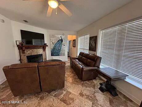 159 Old Starke Road Palatka, FL 32177 - Photo 9 of 13 a living room with furniture a flat screen tv and a fireplace