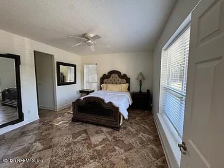 159 Old Starke Road Palatka, FL 32177 - Photo 10 of 13 a bedroom with a bed and a flat tv screen