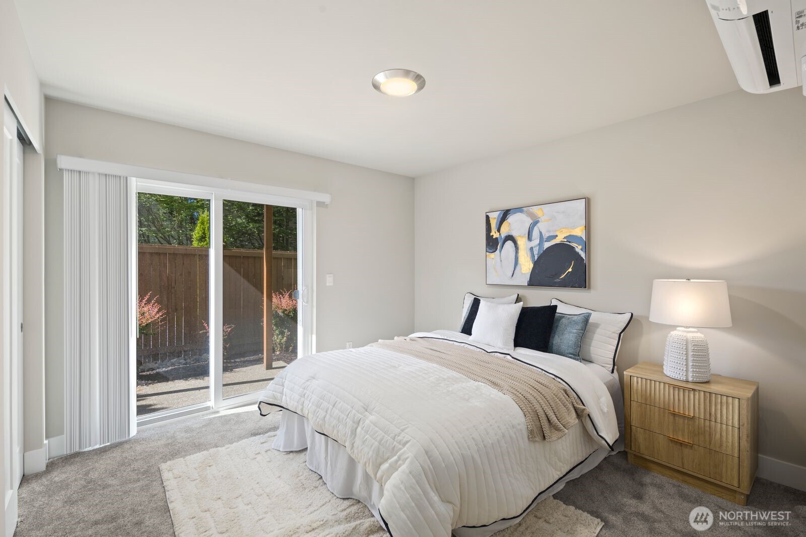 826 238th Place Southeast, Unit F Bothell, WA 98021 - Photo 18 of 39 a bed room with a bed and a night stand