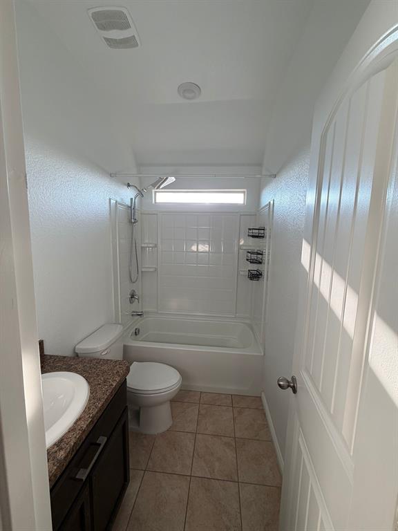 8045 Ballater Drive Fort Worth, TX 76123 - Photo 26 of 26 Bathroom with vanity, washtub / shower combination, and light tile patterned flooring