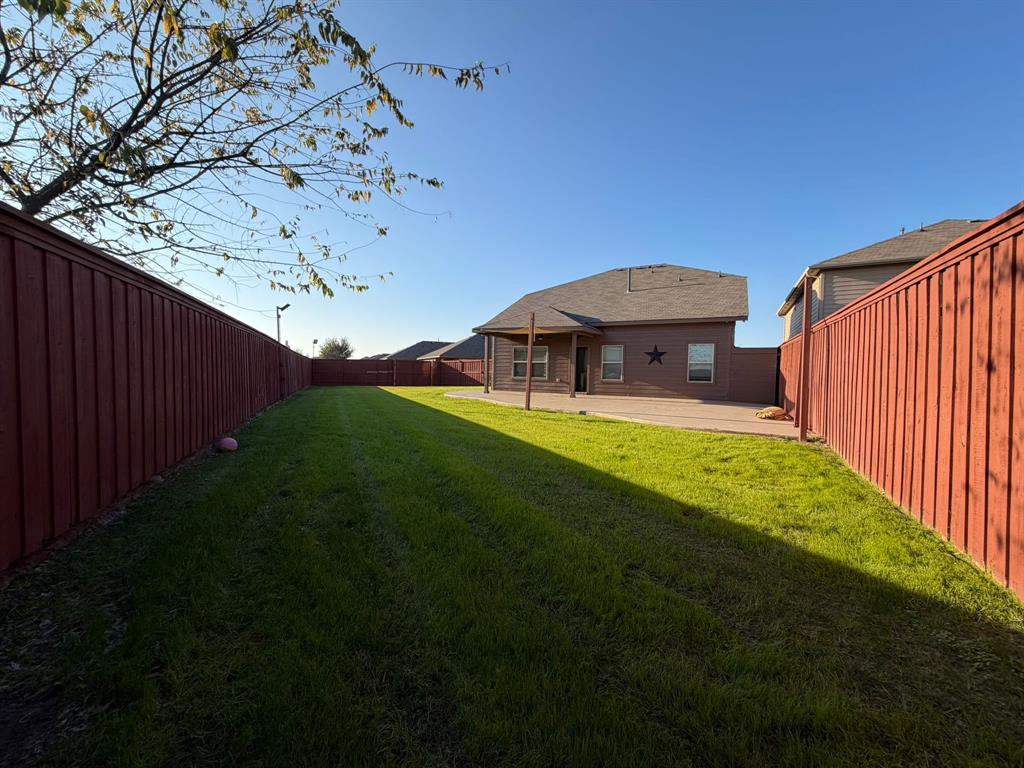 8045 Ballater Drive Fort Worth, TX 76123 - Photo 4 of 26 Fenced backyard featuring a patio area