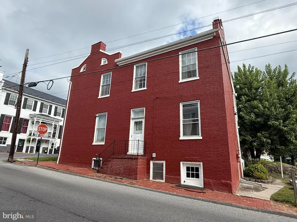 a red brick building that has lot of windows on it