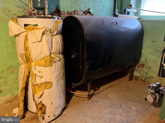 a room with a mirror and a wooden floor