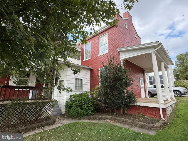 a view of a house with a small yard