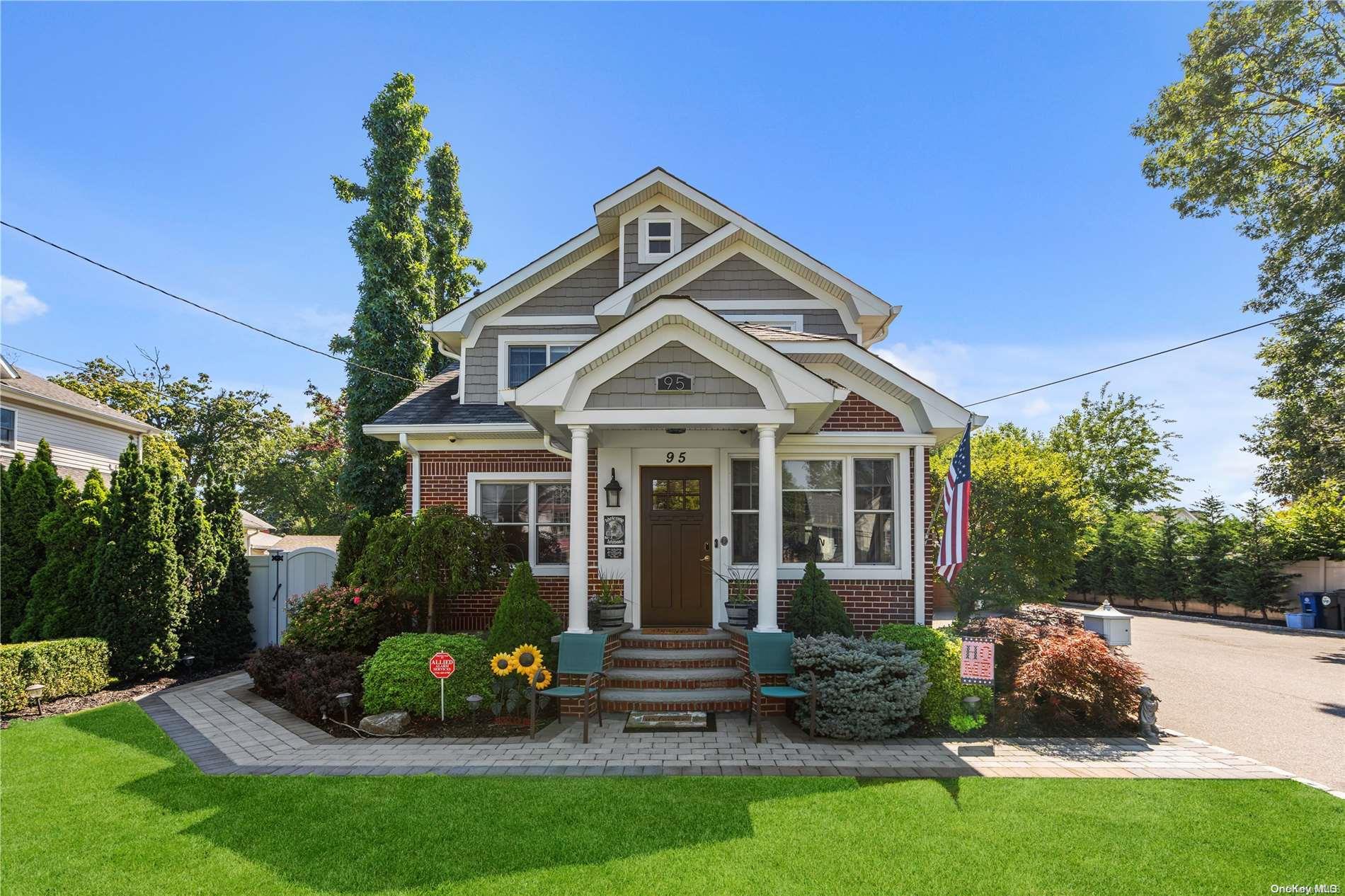 95 Rider Avenue Patchogue, NY 11772 - Photo 1 of 1 a front view of a house with a garden