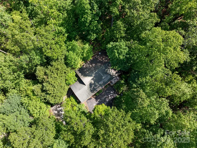 a view of a house with a tree