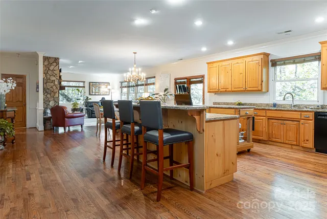a kitchen with lots of counter top space and dining table