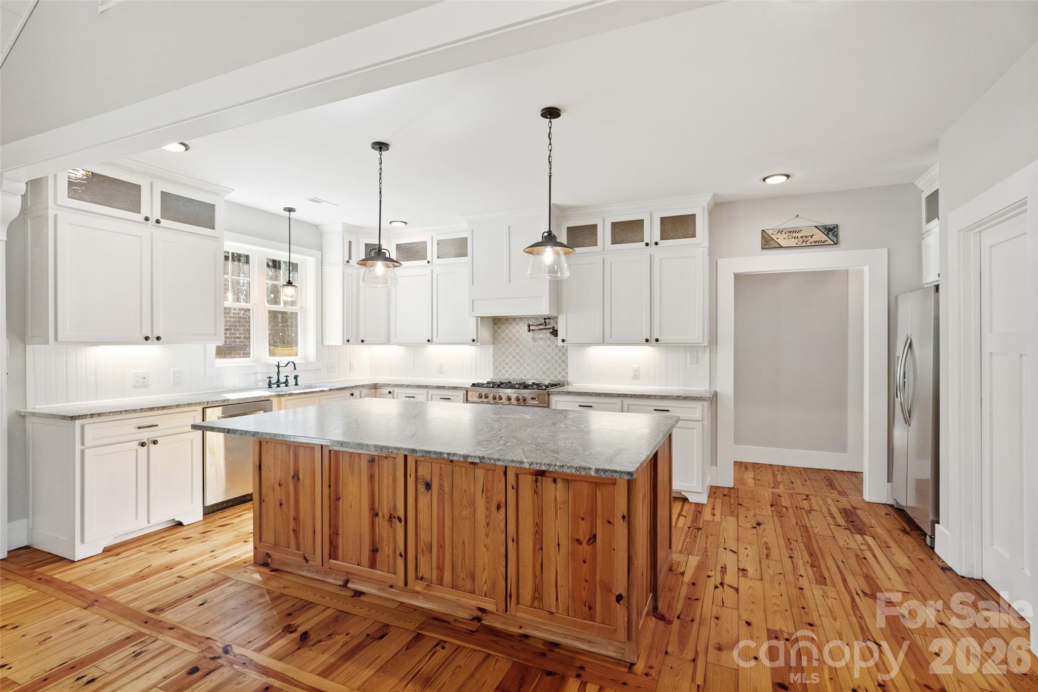 2370 Killian Road Edgemoor, SC 29712 - Photo 11 of 45 a large kitchen with kitchen island a sink stainless steel appliances and cabinets