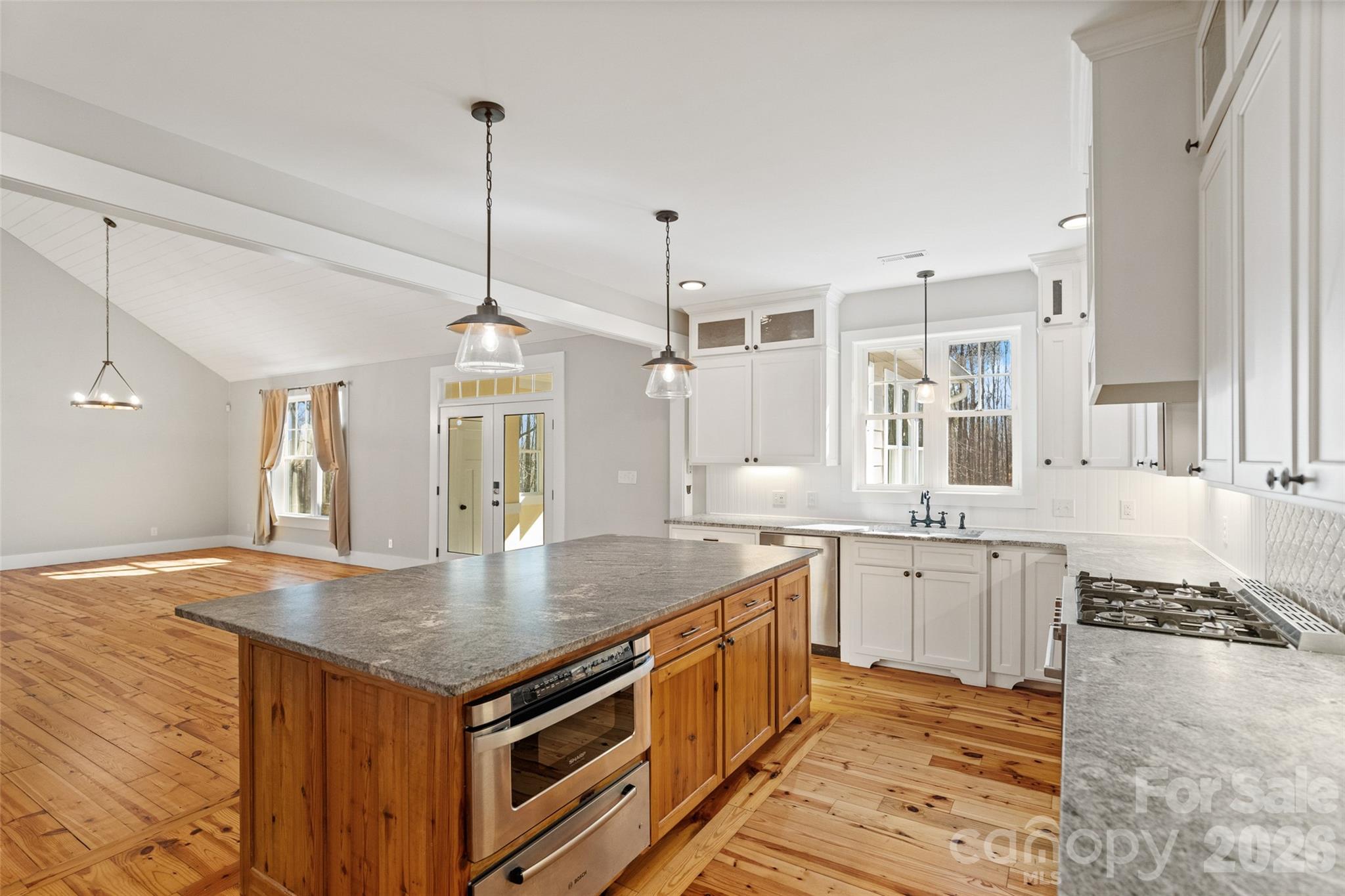 2370 Killian Road Edgemoor, SC 29712 - Photo 12 of 45 a kitchen with center island table and chairs