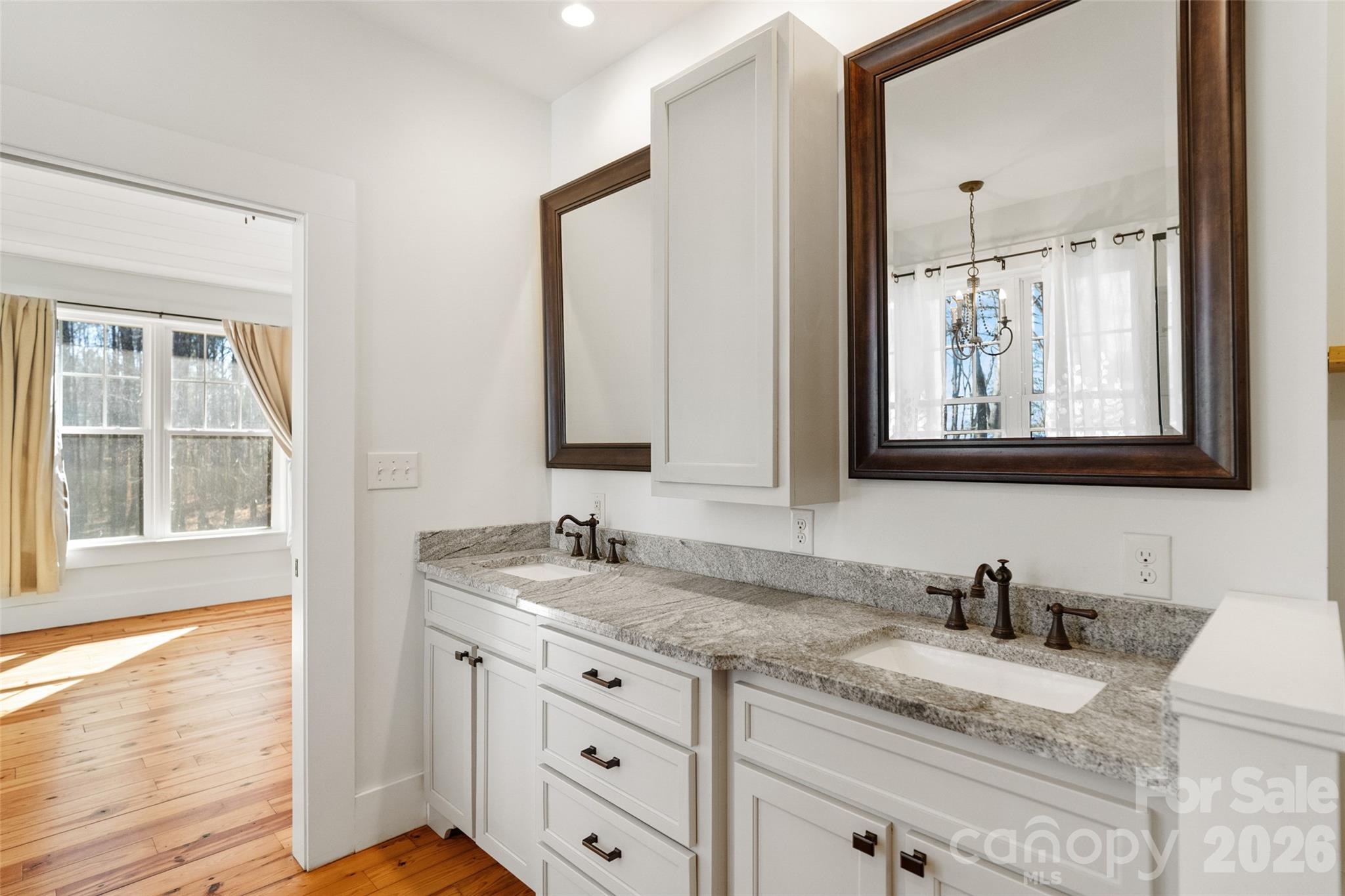 2370 Killian Road Edgemoor, SC 29712 - Photo 14 of 45 a bathroom with a granite countertop sink and a mirror