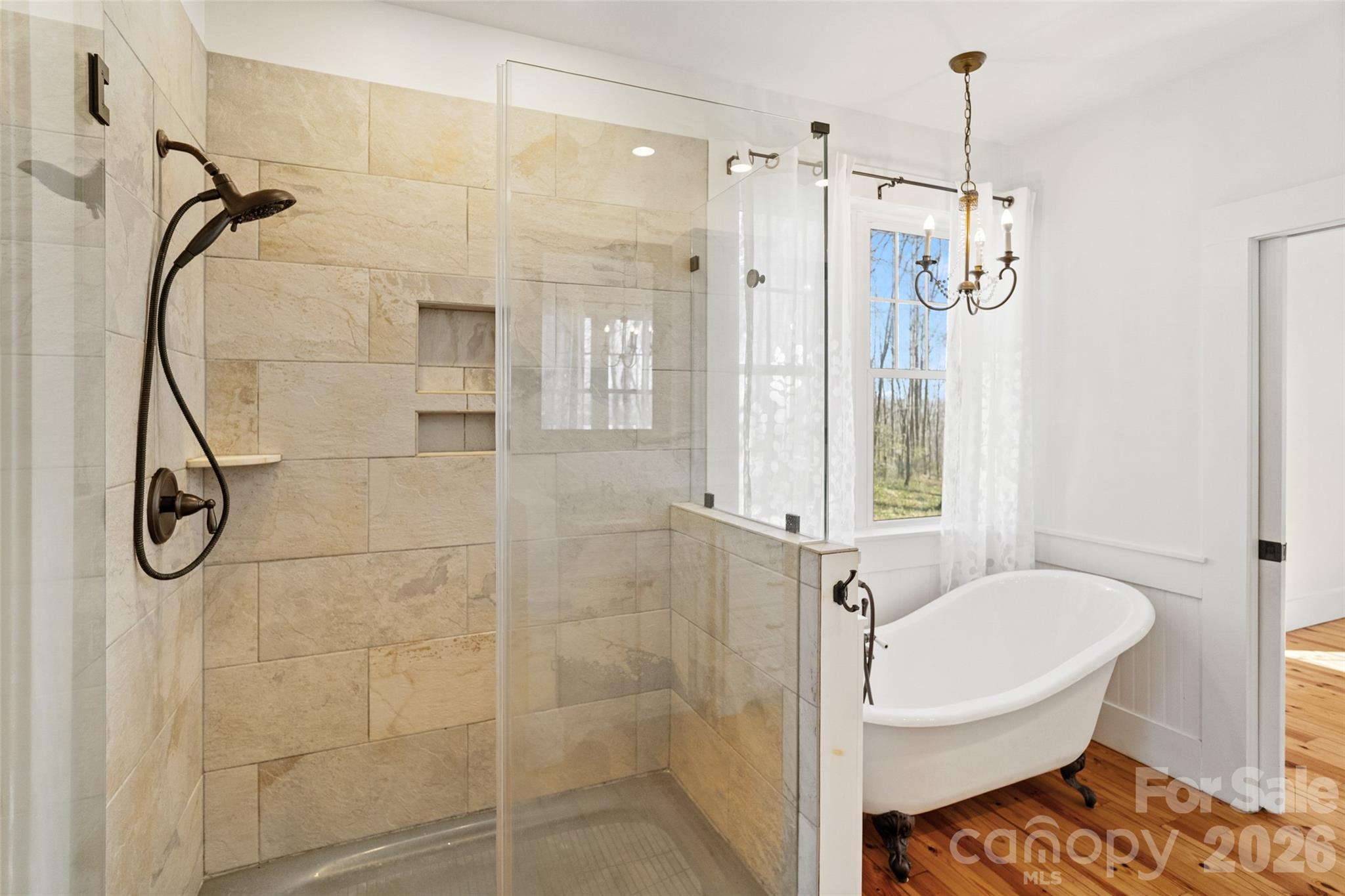 2370 Killian Road Edgemoor, SC 29712 - Photo 15 of 45 a bathroom with a glass shower door