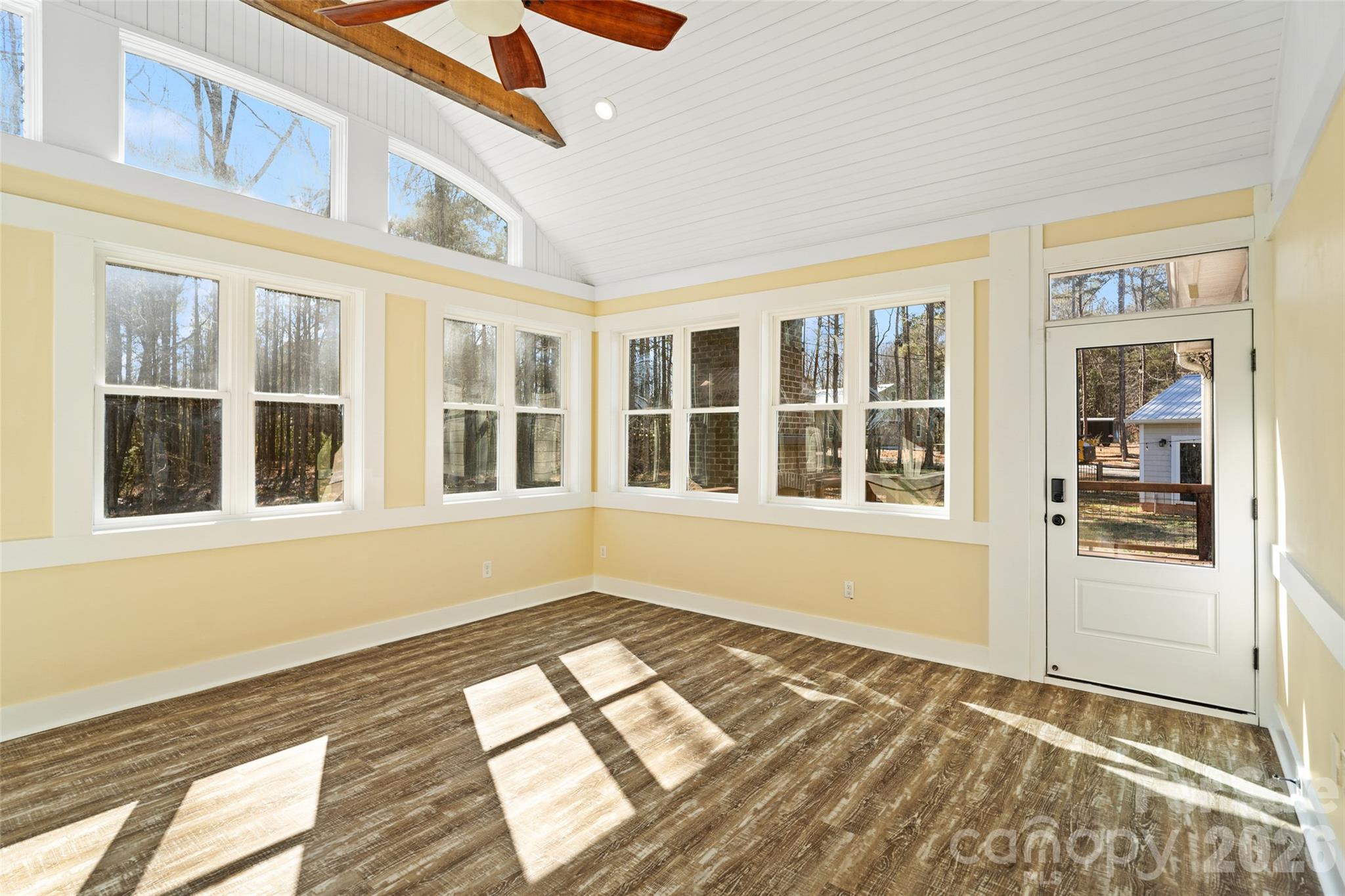 2370 Killian Road Edgemoor, SC 29712 - Photo 26 of 45 a view of an empty room with wooden floor and a window
