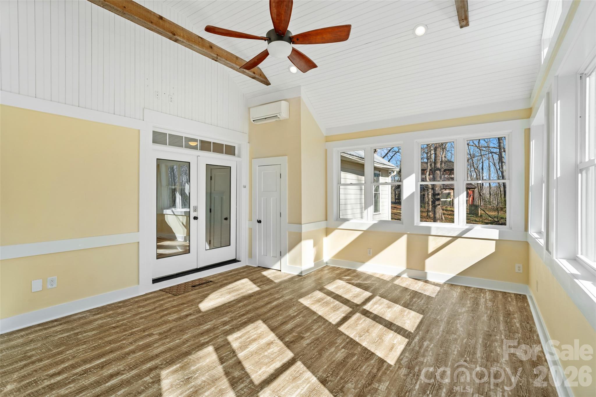 2370 Killian Road Edgemoor, SC 29712 - Photo 27 of 45 a view of a bedroom with wooden floor and a ceiling fan