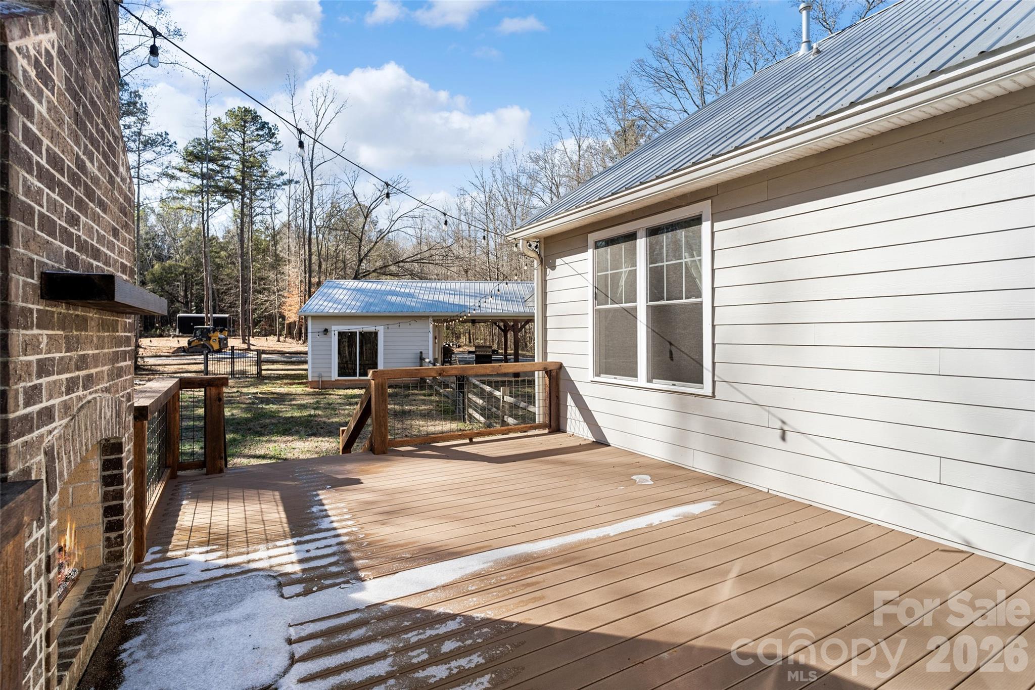 2370 Killian Road Edgemoor, SC 29712 - Photo 29 of 45 a view of a patio with table and chairs with wooden floor and fence