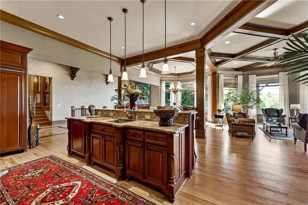 a dining room with furniture and wooden floor
